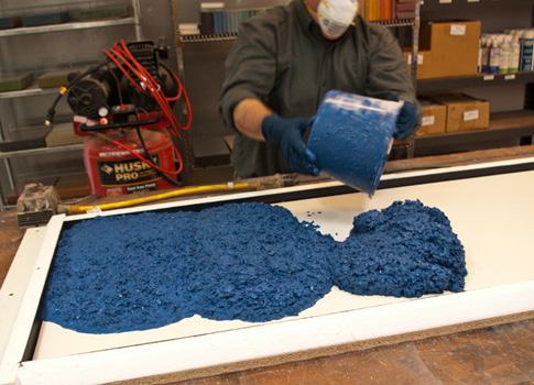 Pouring recycled-glass concrete into a form