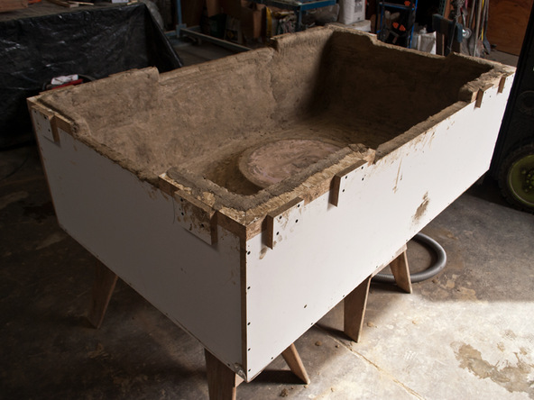 Spraying and Backing Step 4.1 - Fabric Formed Concrete Fire Table | CHENG Concrete Exchange