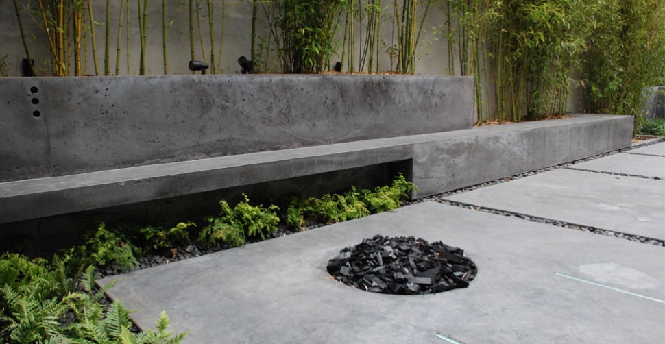 Outdoor concrete living area with concrete firepit | CHENG Concrete Exchange