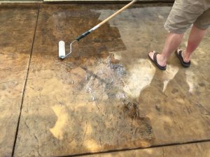 Applying Surecrete HS240 sealer to our concrete patio