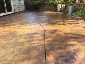 The finished product after staining and sealing our concrete patio