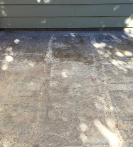 worn-weathered-stamped-concrete-patio